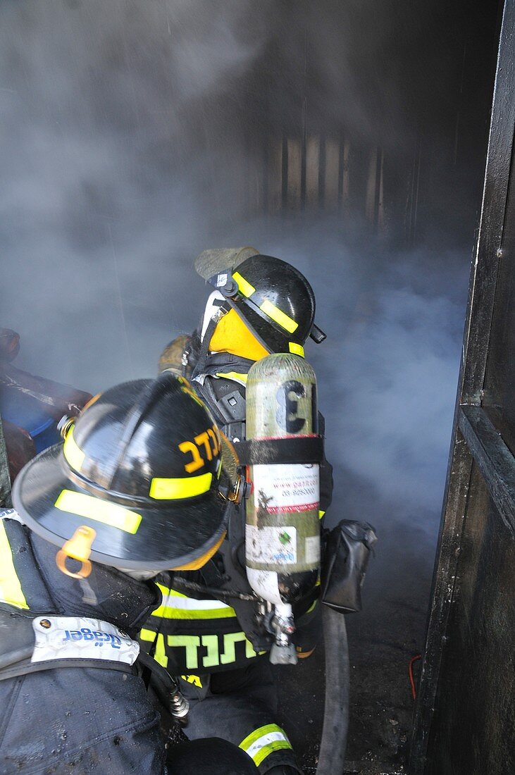 Firefighters with protective equipment