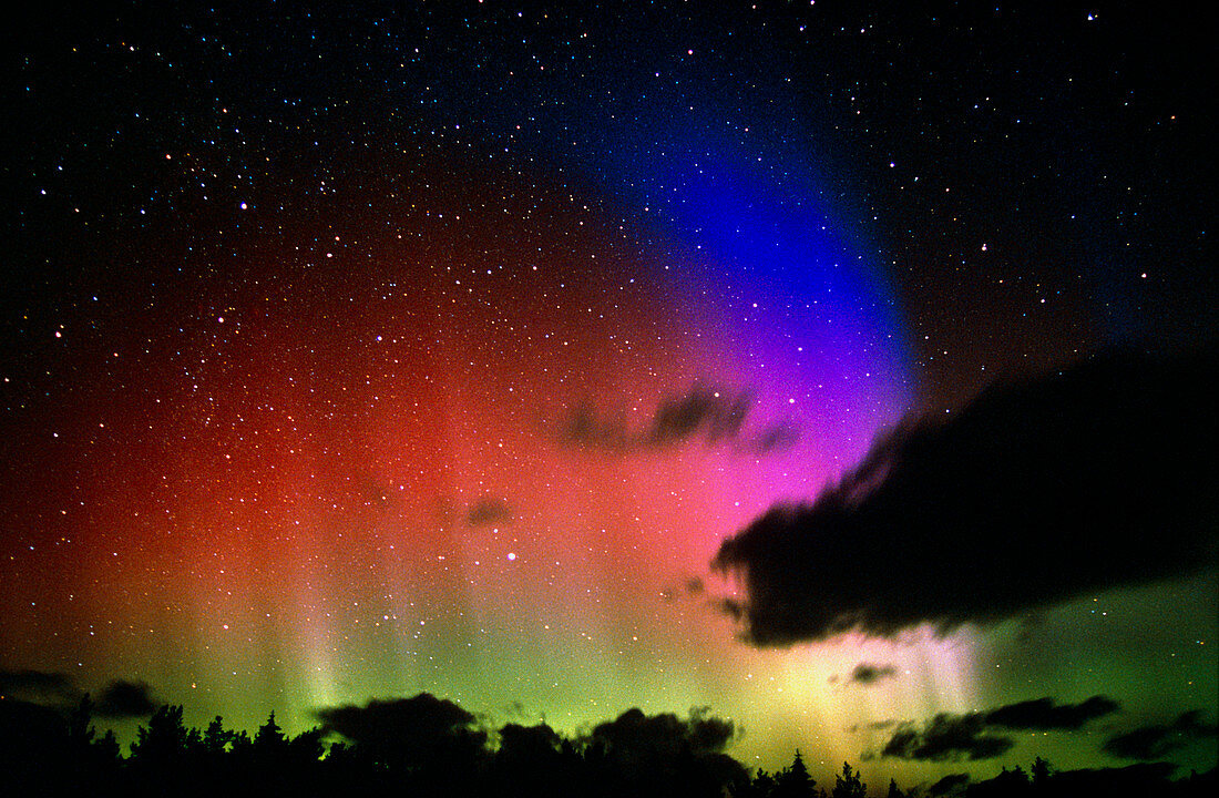 Aurora Borealis display with clouds