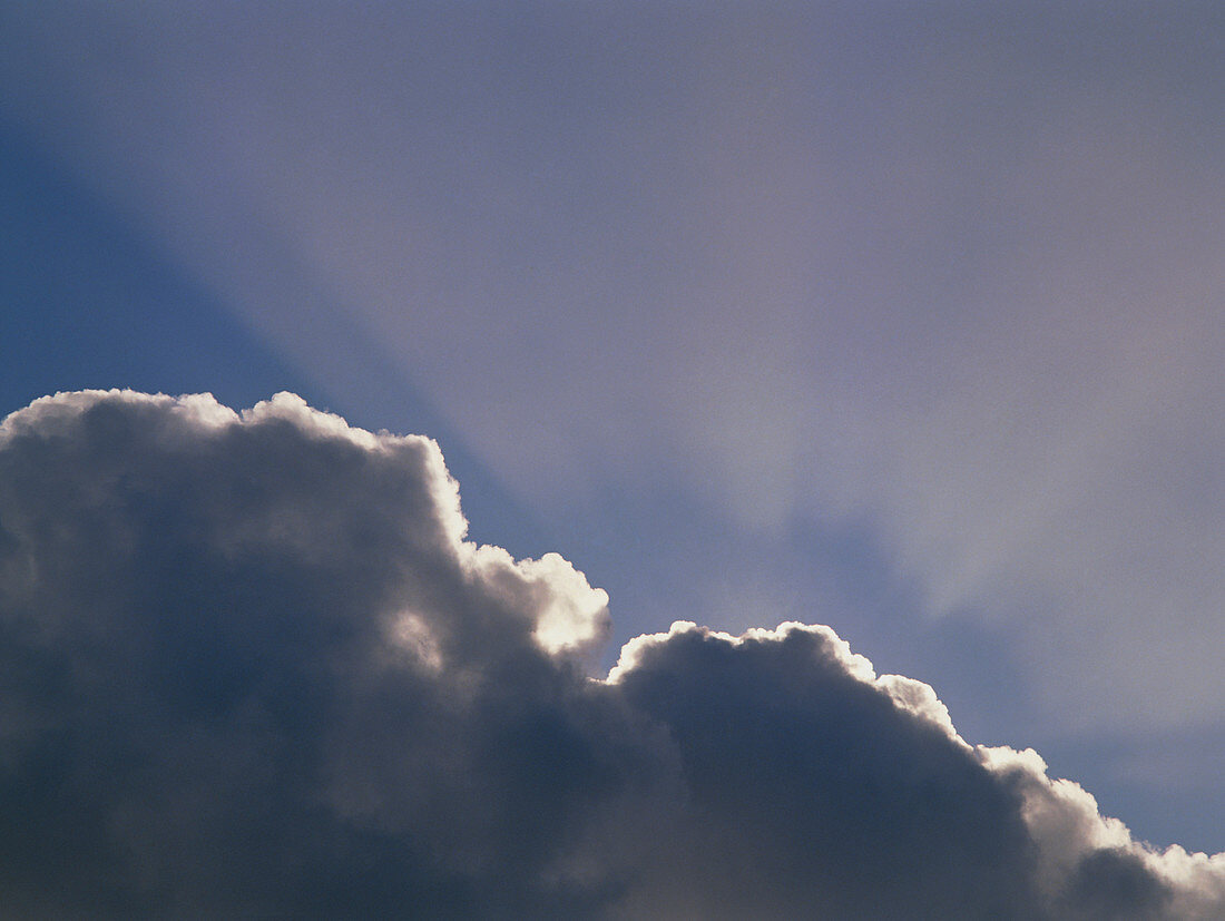 Cumulus cloud with sun-rays