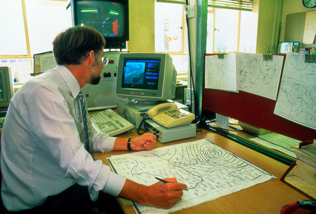 Meteorologist compiling a weather chart