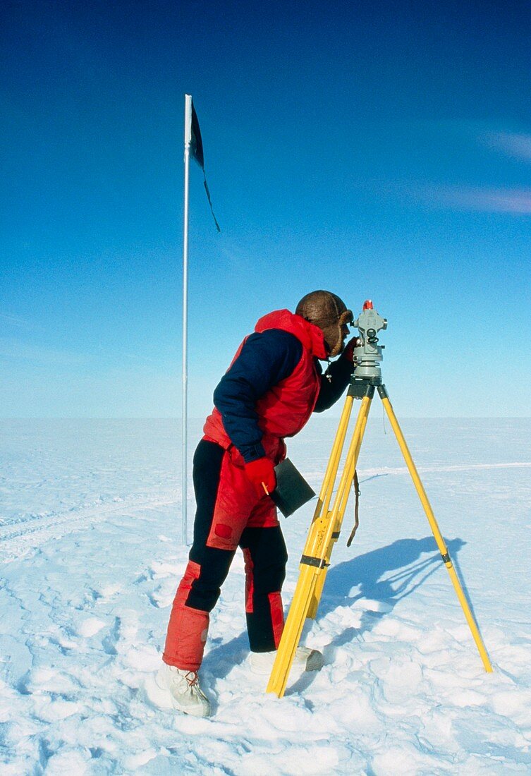 Glaciologist using theodolite on Ronne Ice Shelf