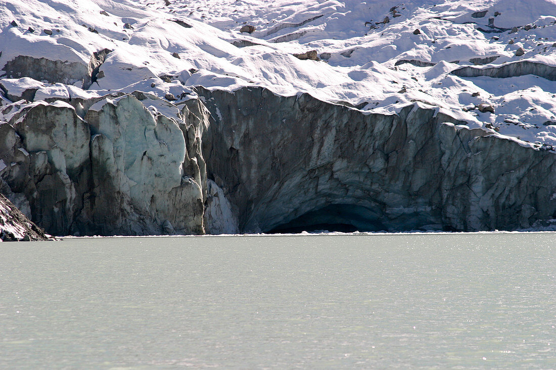 Roseg glacier by a lake