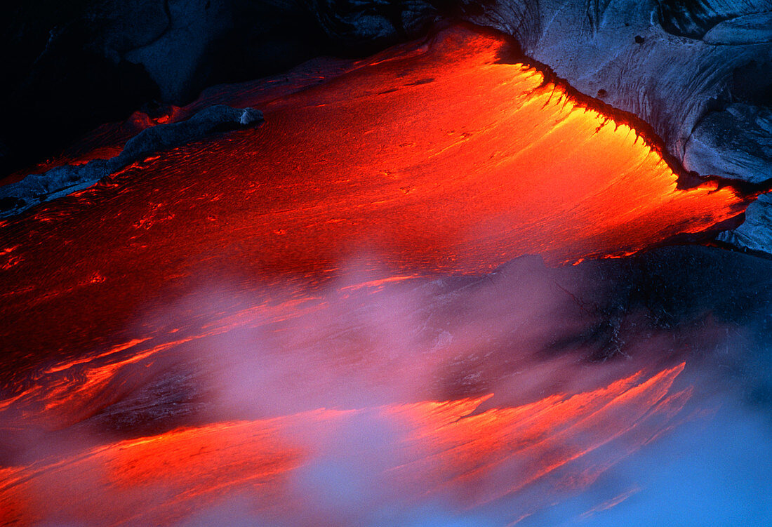 Molten pahoehoe lava spilling from a lava tube