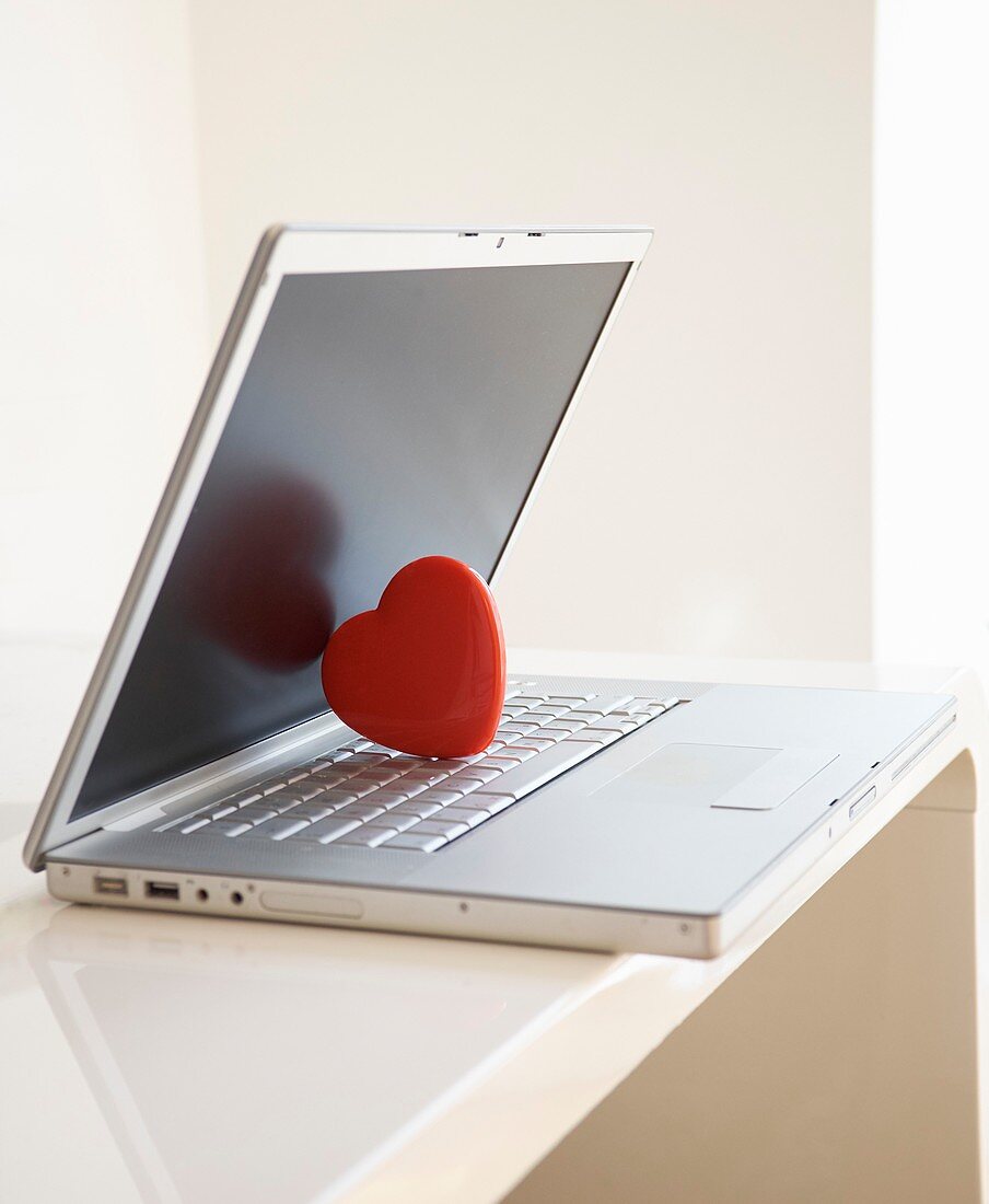 Red heart on laptop computer