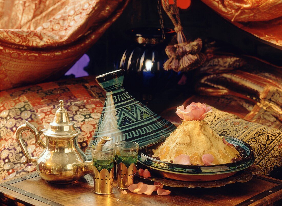 Moroccan still life with sweet couscous and fresh tea