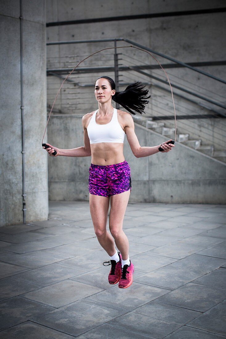 Woman skipping with rope