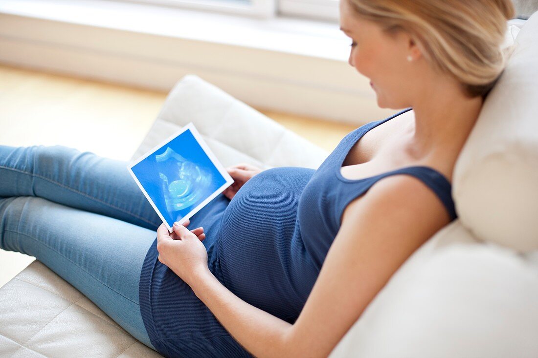 Pregnant woman looking at baby scan