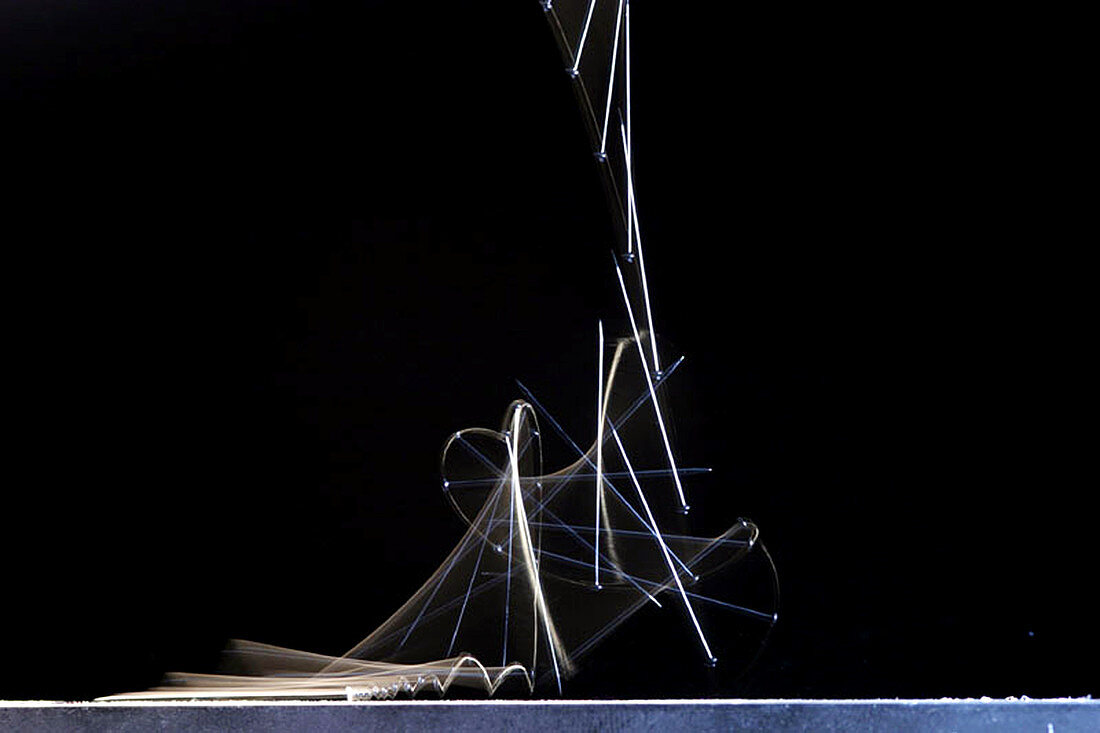 High speed strobe image of pin dropping