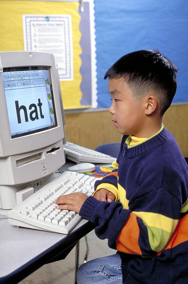 First grade student working on a computer