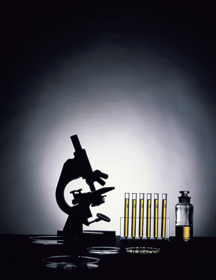Still life with microscope and test tubes