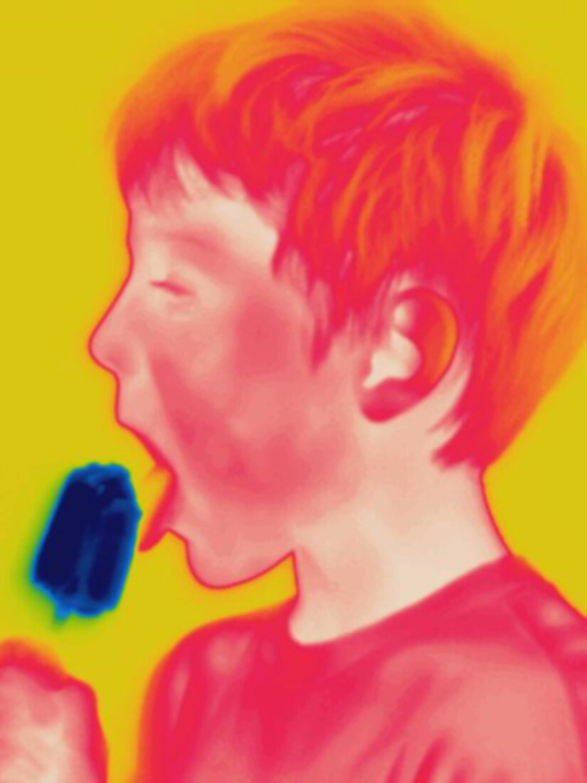 Thermogram of boy eating a popsicle