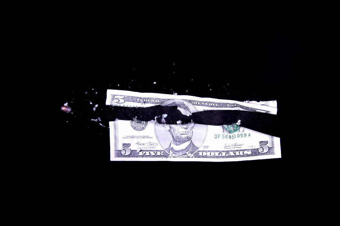 Bullet Hitting a Five Dollar Bill