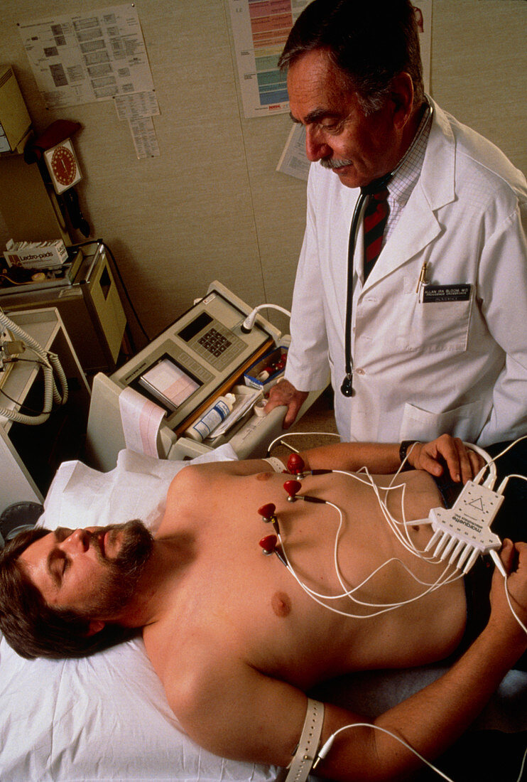 Doctor performing electocardiography (ECG)