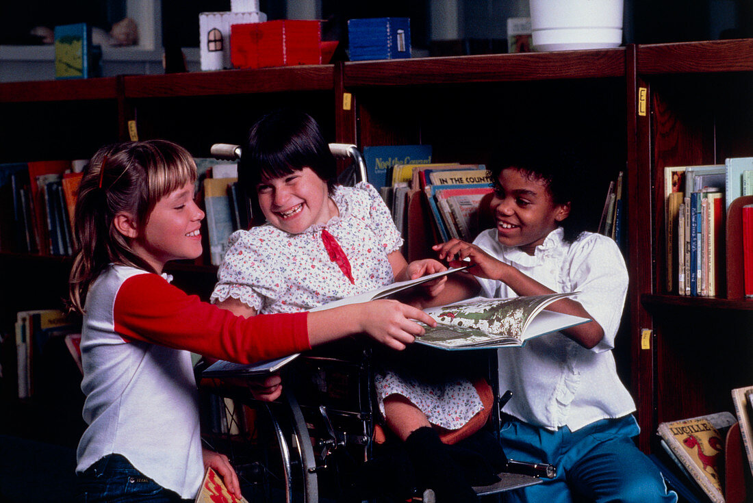 Disabled child in school library