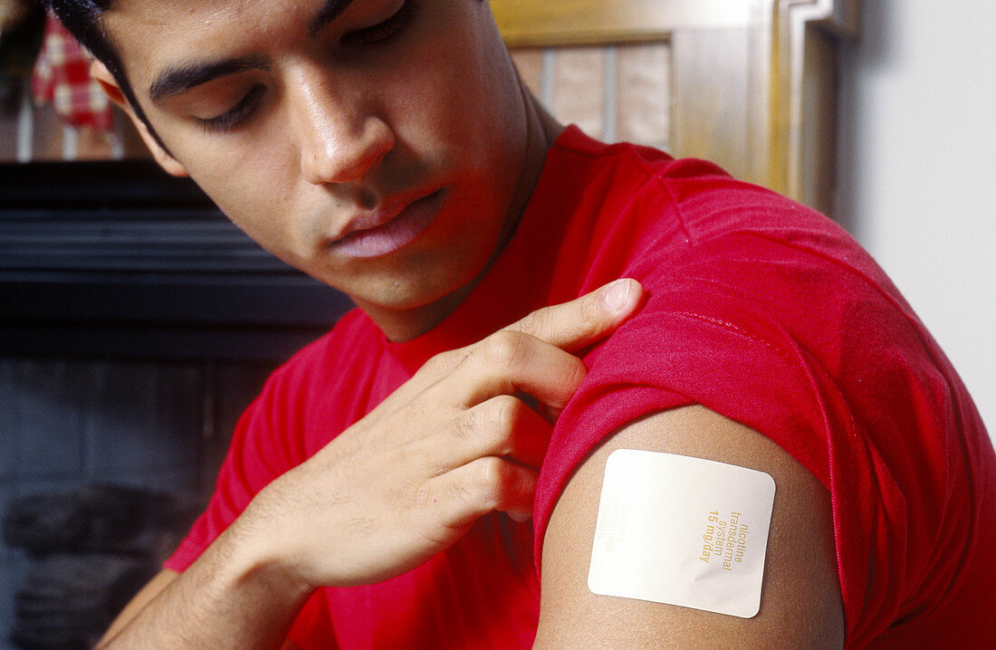 Man with nicotine patch on arm
