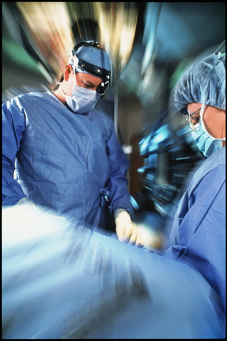 Blurred view of surgical team during an operation