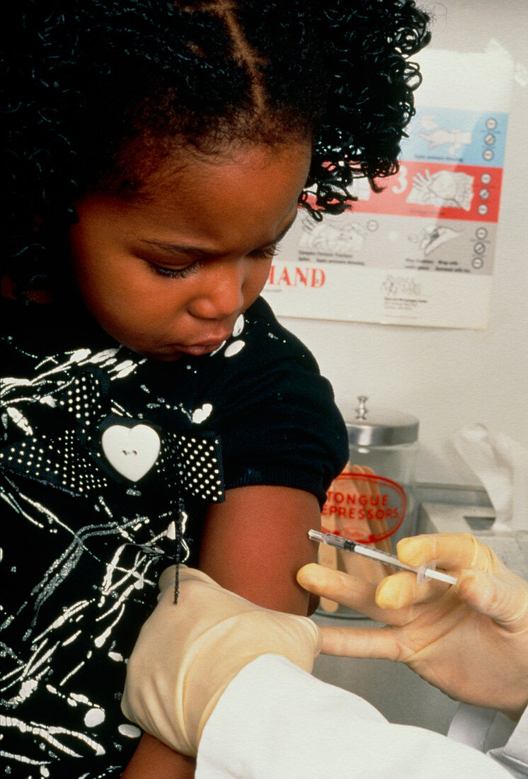 Young girl having vaccine injected into her arm