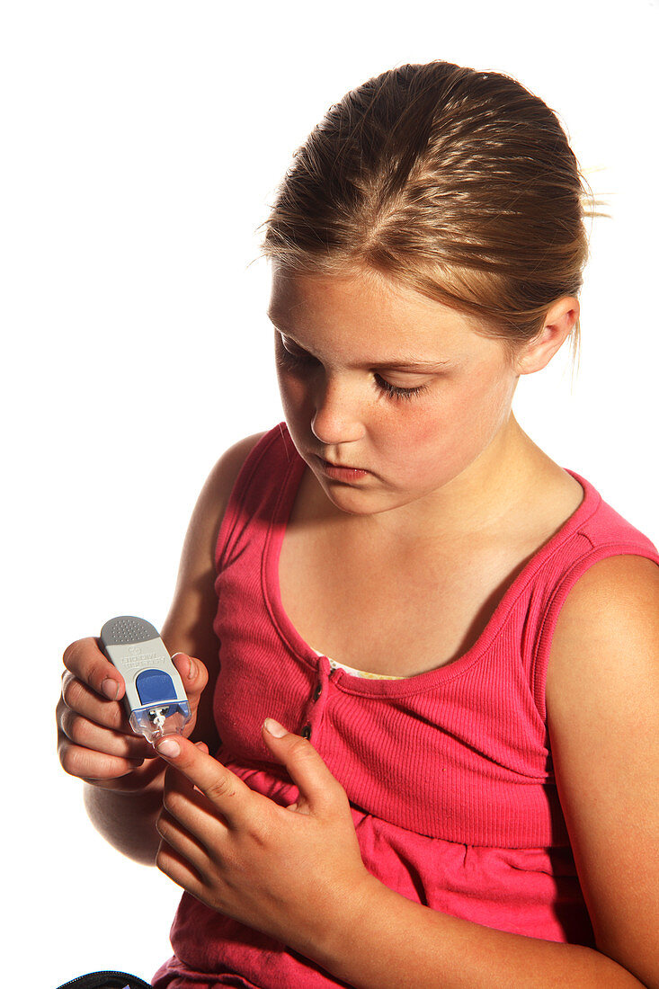 Diabetic Child with Blood Glucose Tester
