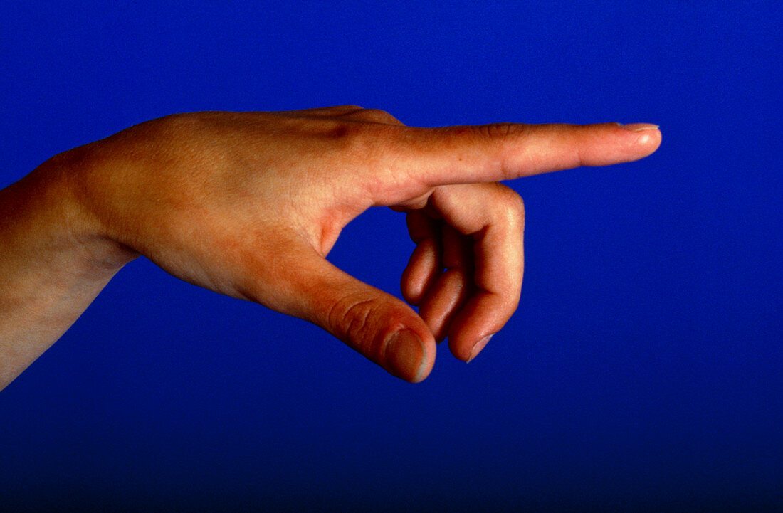 Side view of female hand with pointed index finger