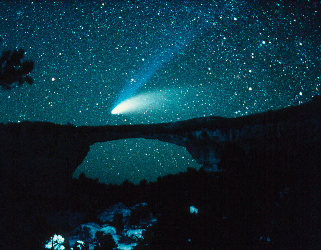Optical image of comet Hale-Bopp over rock arch