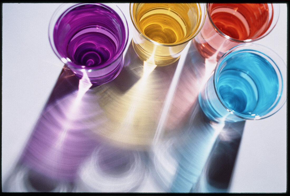 View of beakers containing coloured liquids