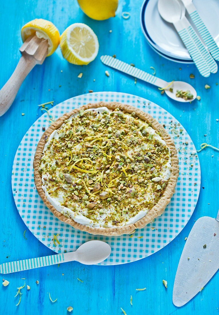 Lemon and caramel tart topped with pistachio nuts