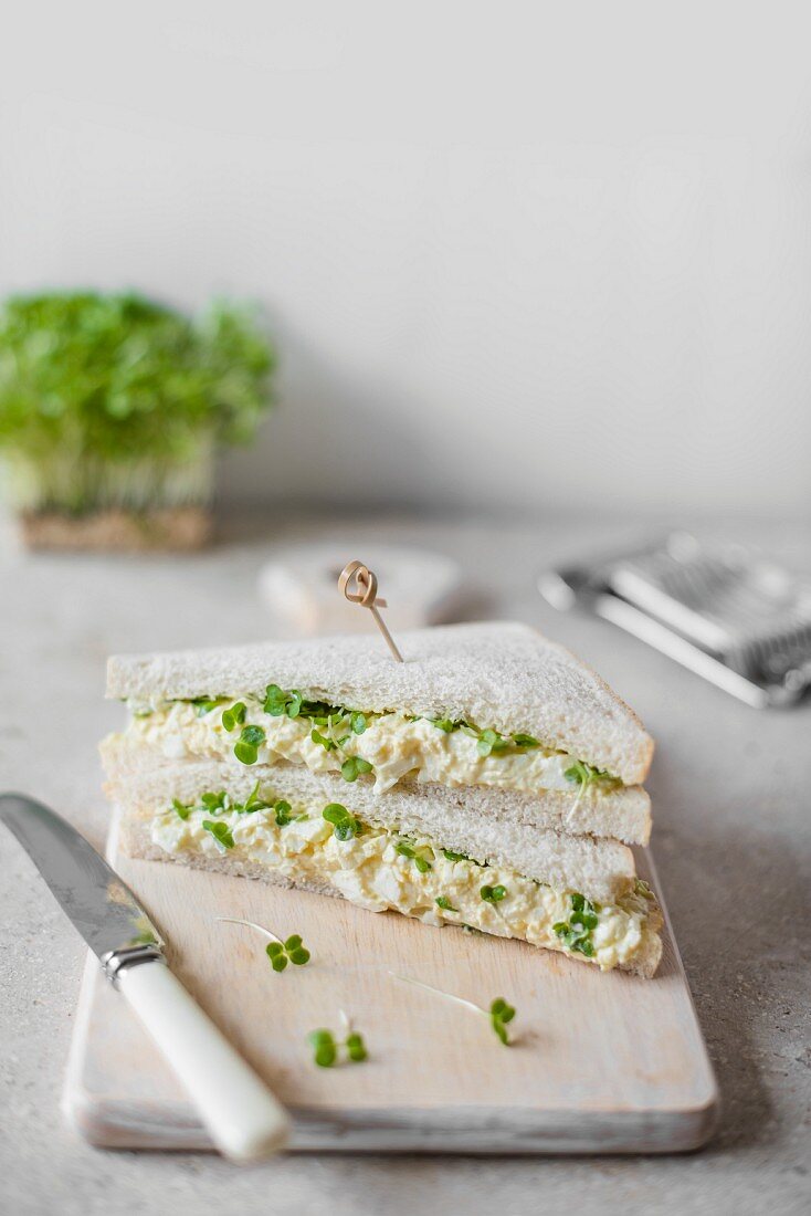 Egg and cress sandwiches on a chopping board