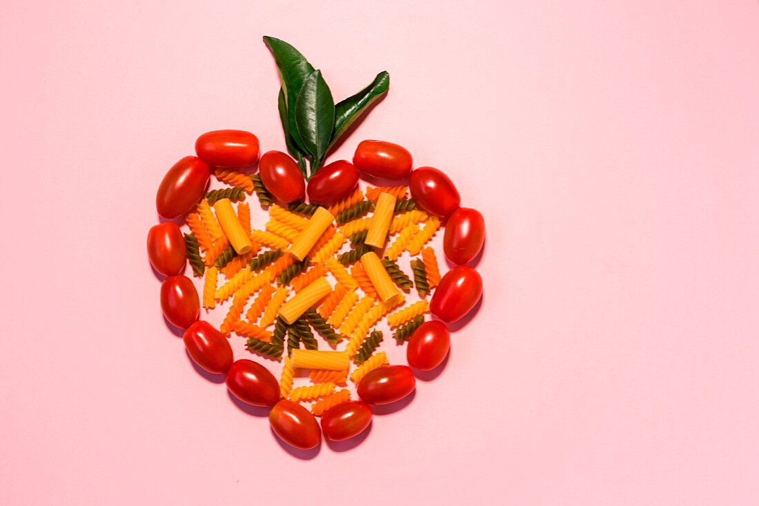 Assorted colourful pasta in a tomato heart