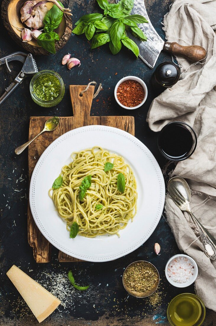 Spaghetti with pesto sauce and fresh basil, Parmesan cheese and spices