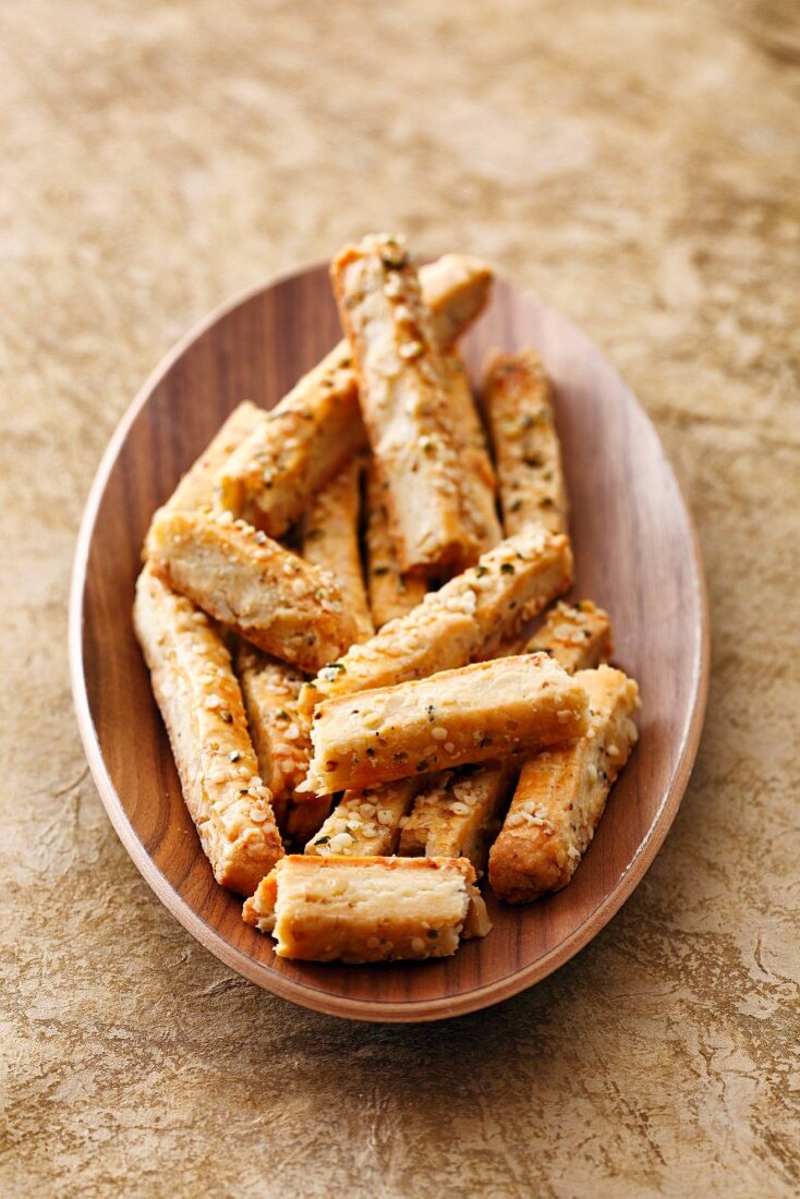 Savoury shortbread sticks with sesame seeds and rosemary