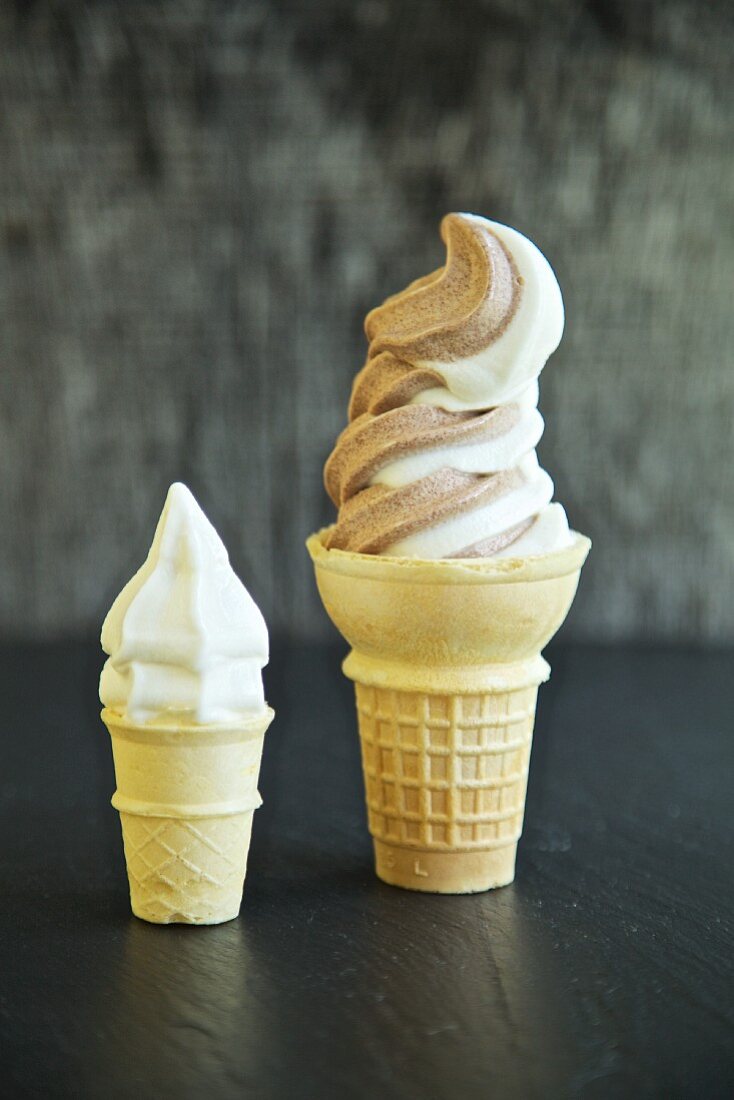 A small and large ice cream cone with Italian soft-serve ice cream