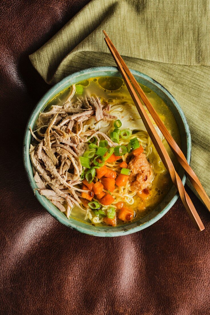 Japanese ramen soup with kalua pork and cabbage