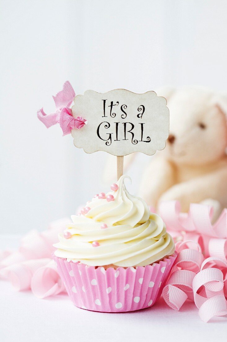 Cupcake with it s a girl pick