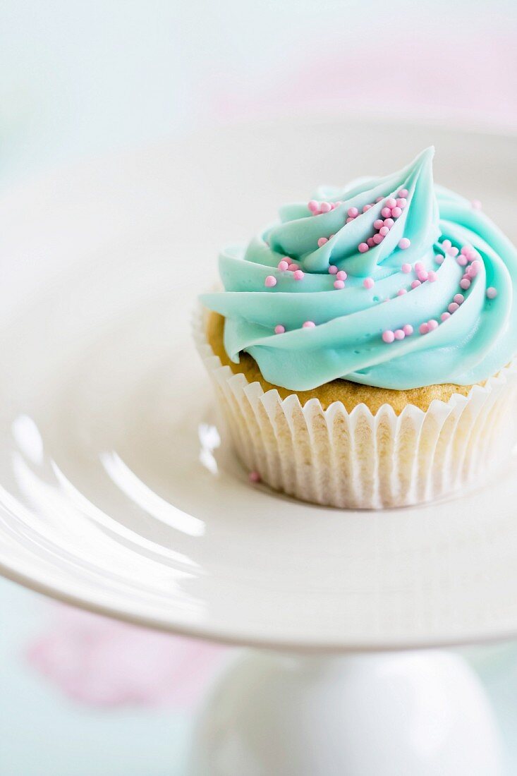Cupcake decorated with pink sugar sprinkles