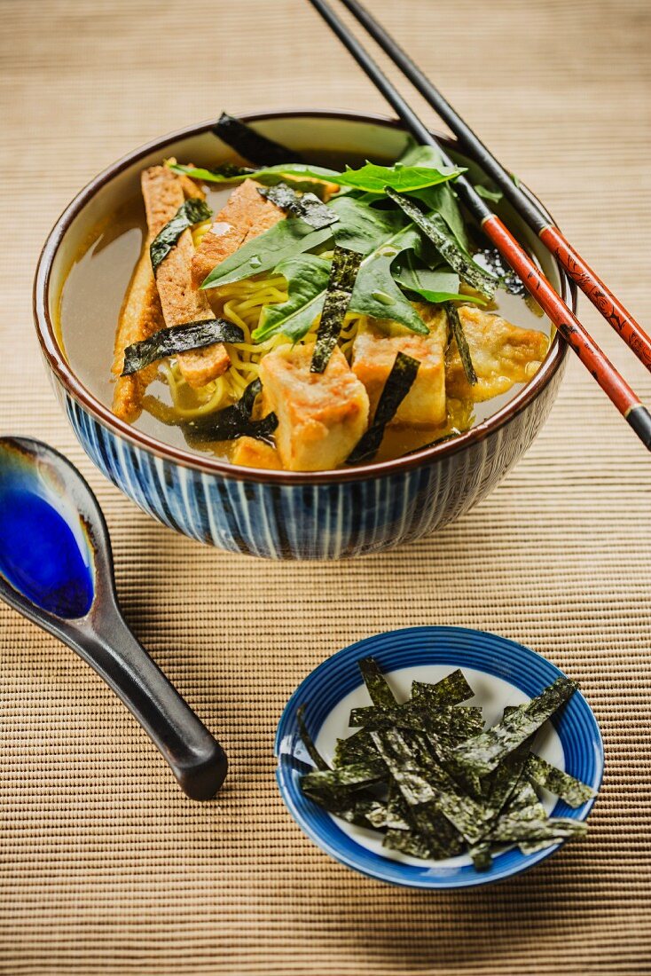 Japanese ramen soup with spicy tofu and seaweed