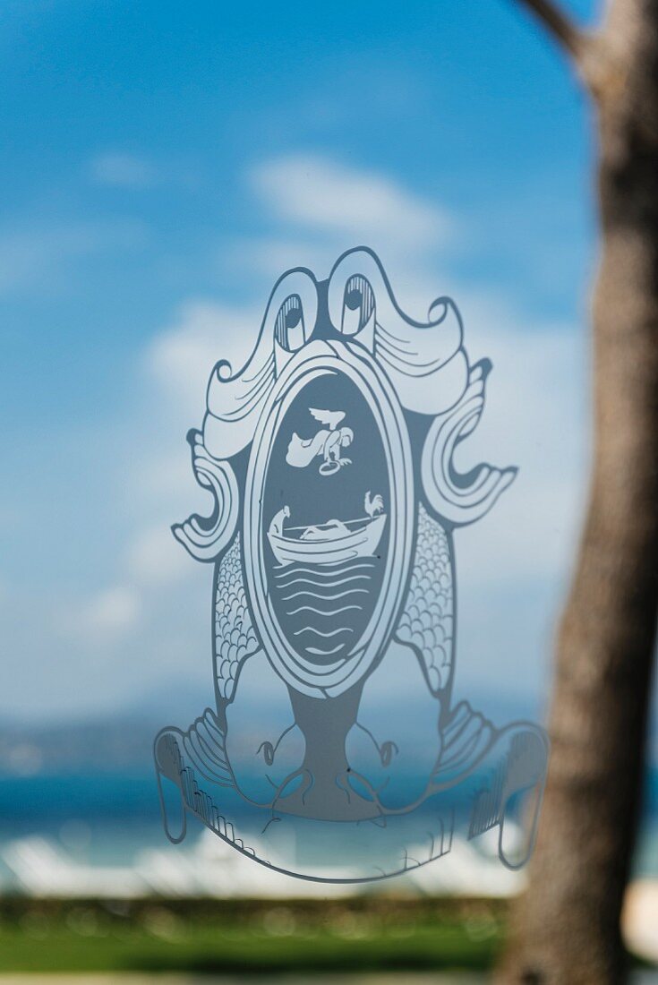 The coat of arms of the La Vague d'Or restaurant in Saint Tropez