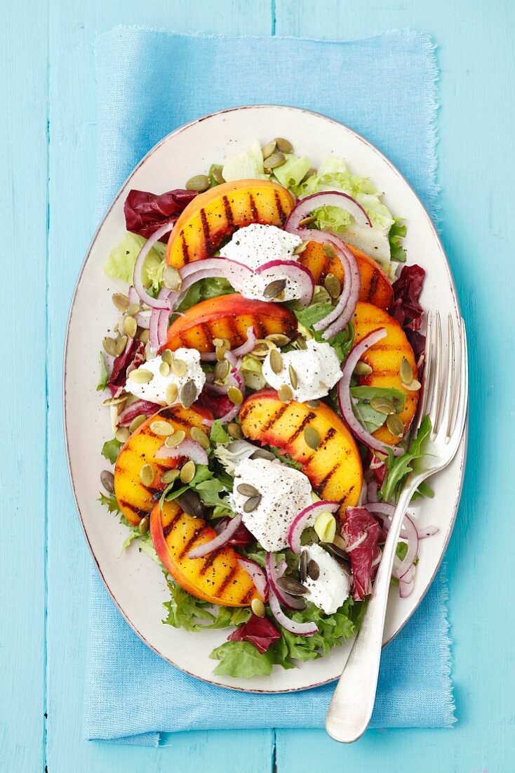 A salad with grilled peaches and goats' cheese