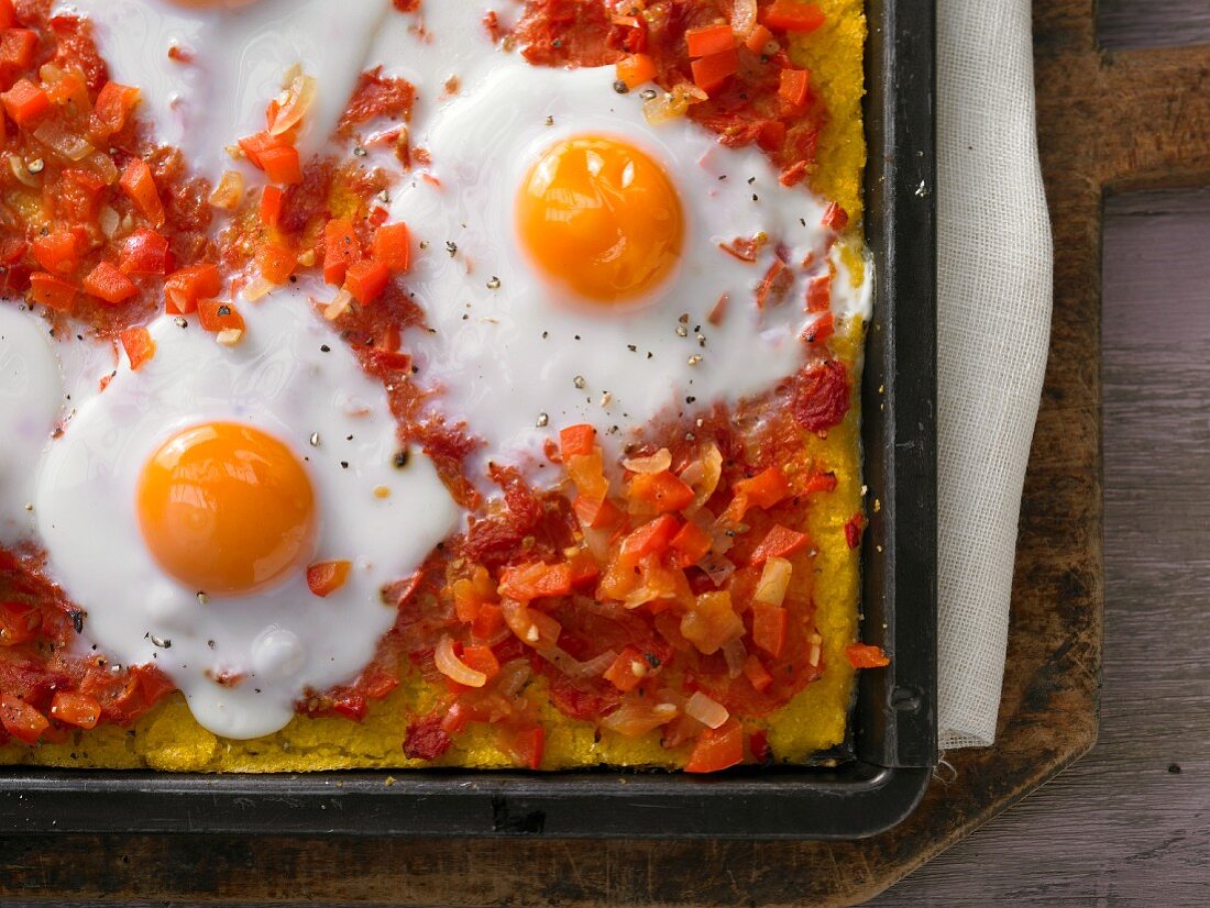Mexican-style polenta pizza with red pepper salsa and egg