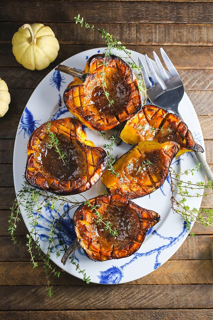 Roasted pumpkin with thyme on a plate