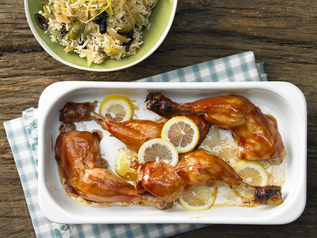 Marinated chicken legs with lemon and olive rice