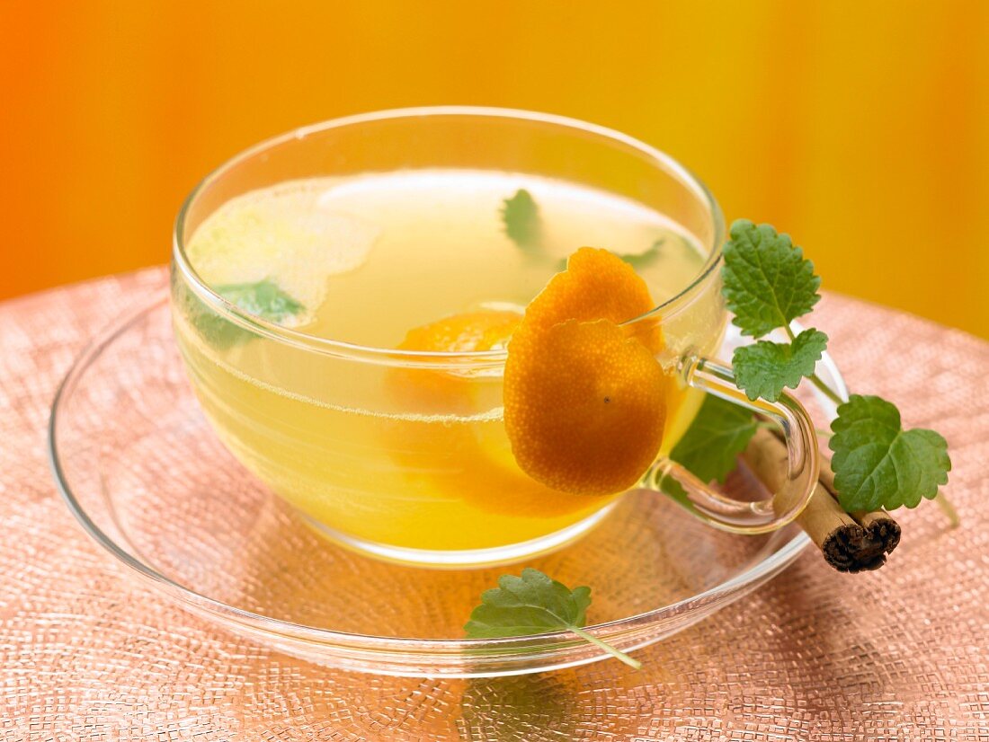 Lemon balm and cinnamon tea with orange juice
