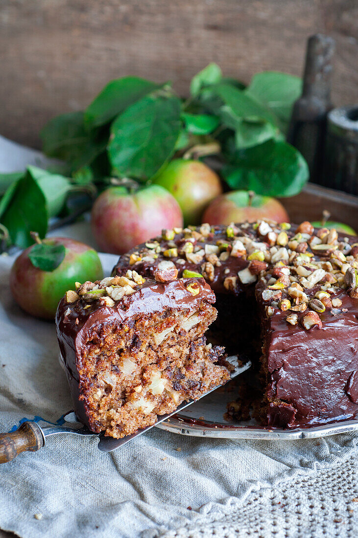 Apple and chocolate cake with nuts and pistachios