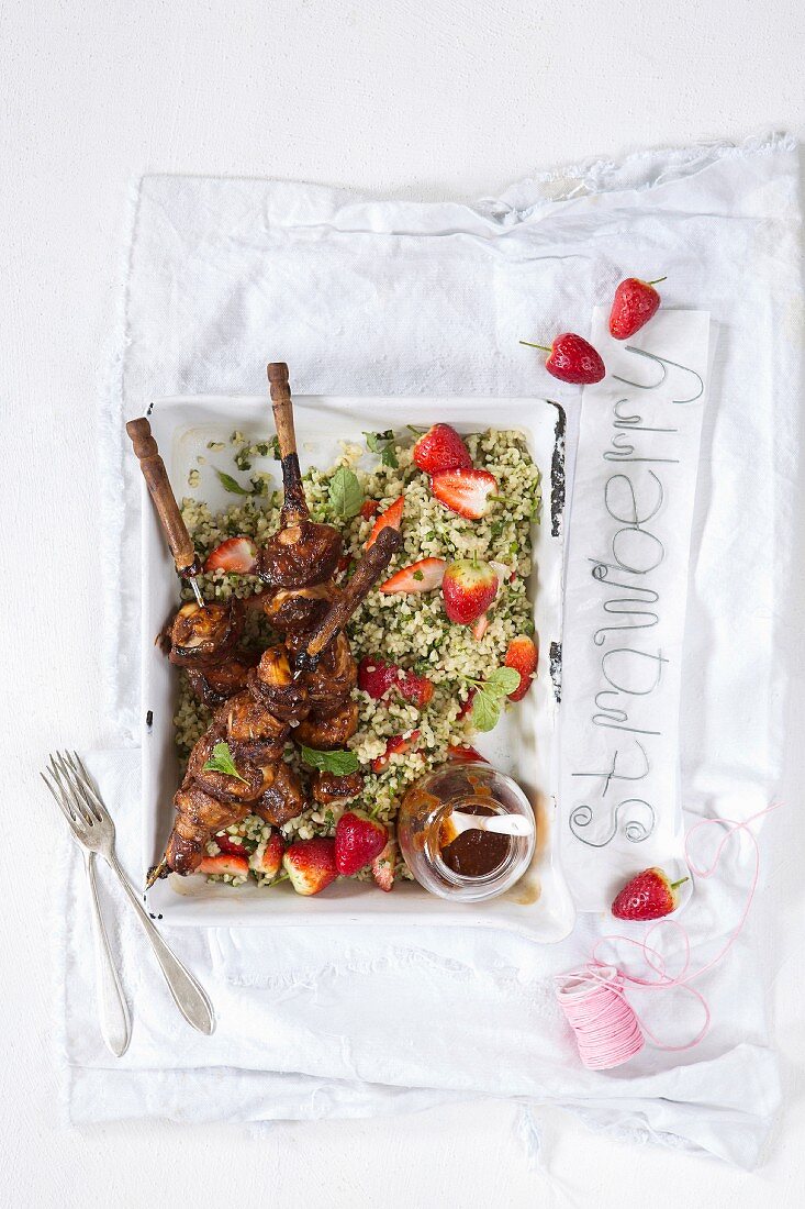 BBQ chicken skewers in a strawberry and whiskey marinade with strawberry tabouleh