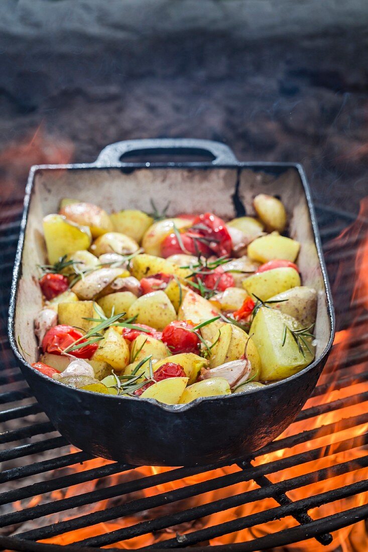 Homemade baked potatoes with garlic, rosemary and oil