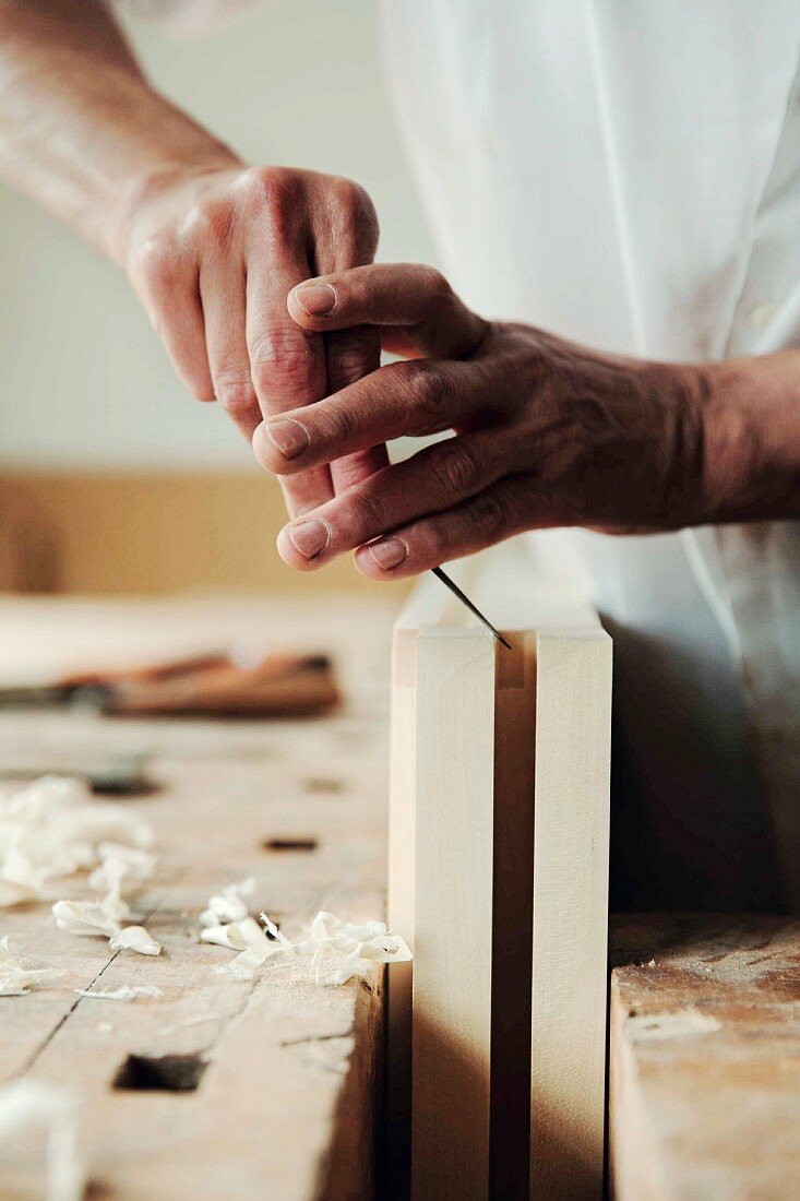 Wood being shaped with a chisel