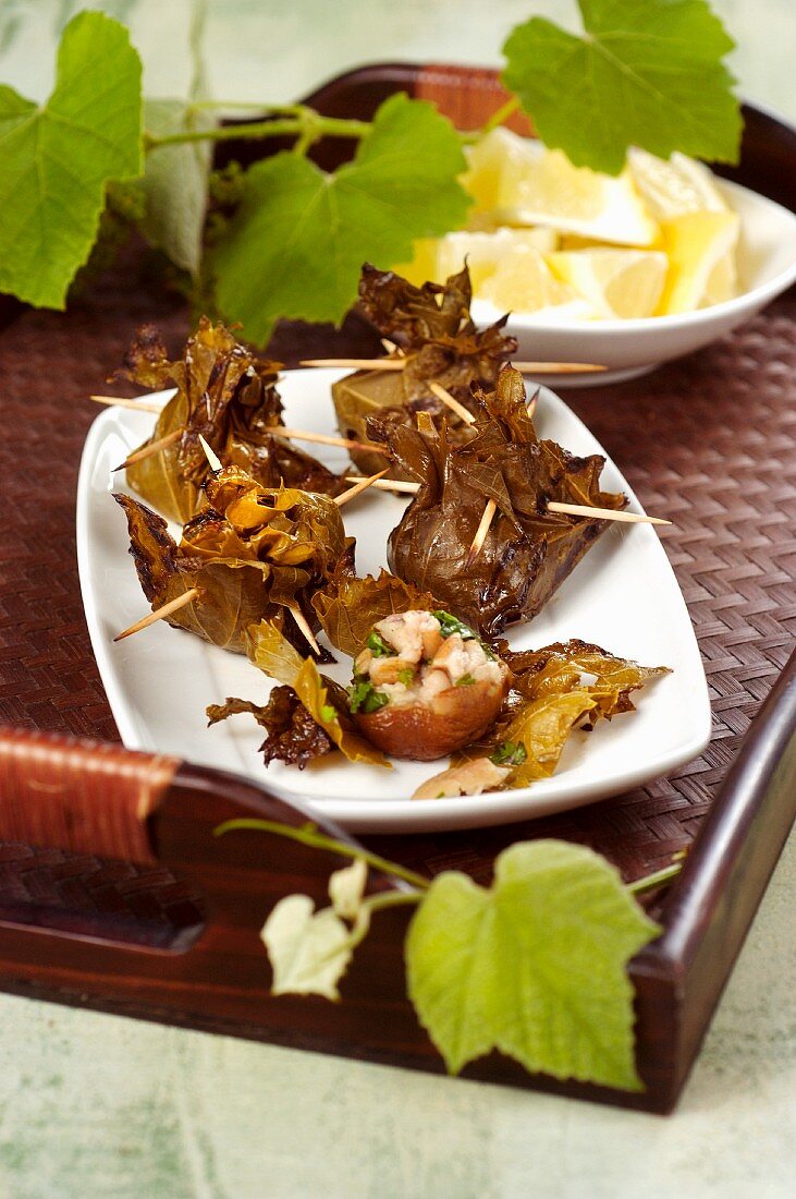 Mushrooms in vine leaves