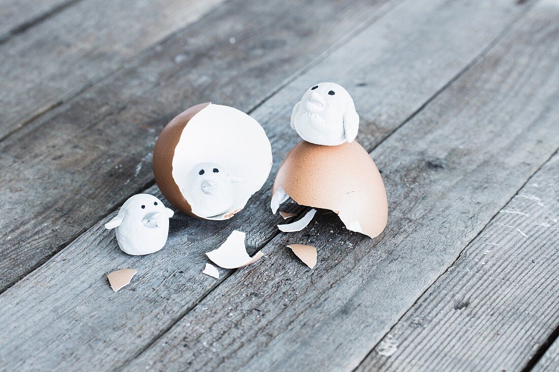 Tiny polymer clay birds on egg shell