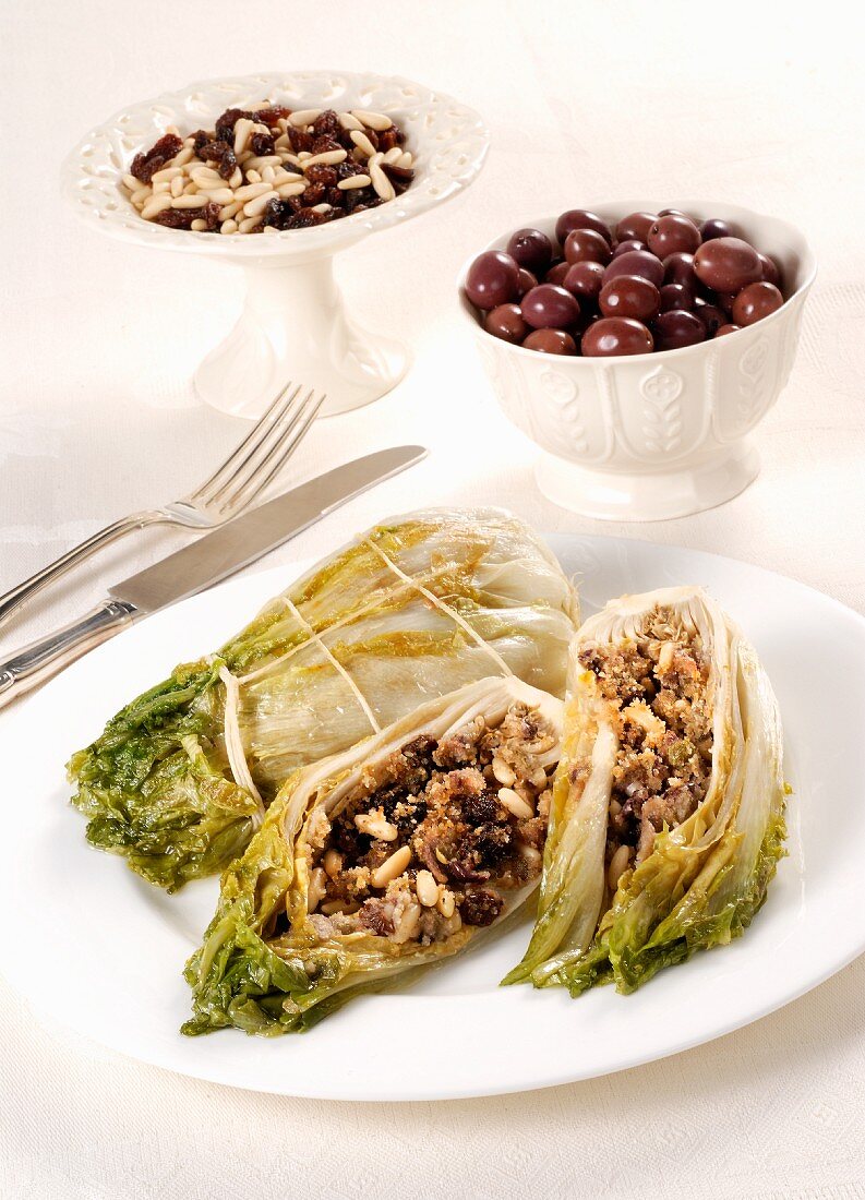 Stuffed endives with olives, raisins and pine nuts