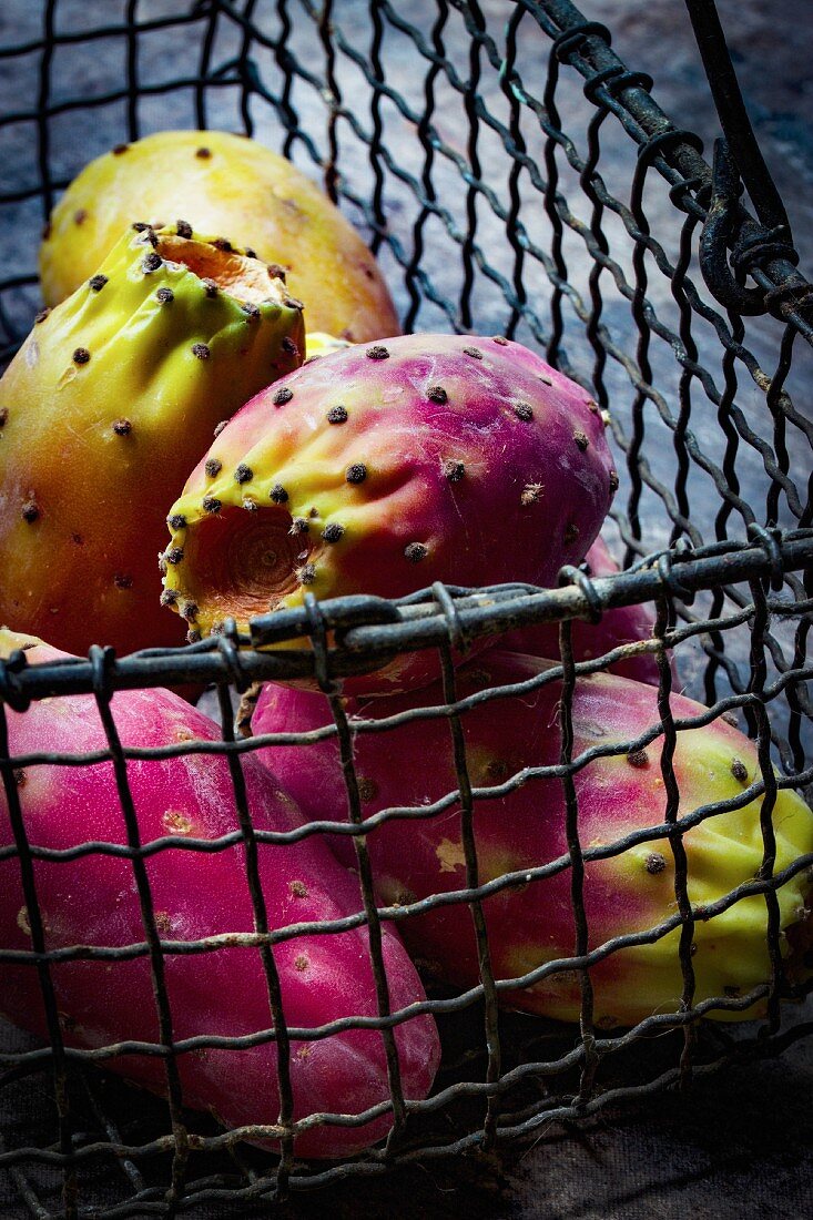 Fresh prickly pears in a wire basket