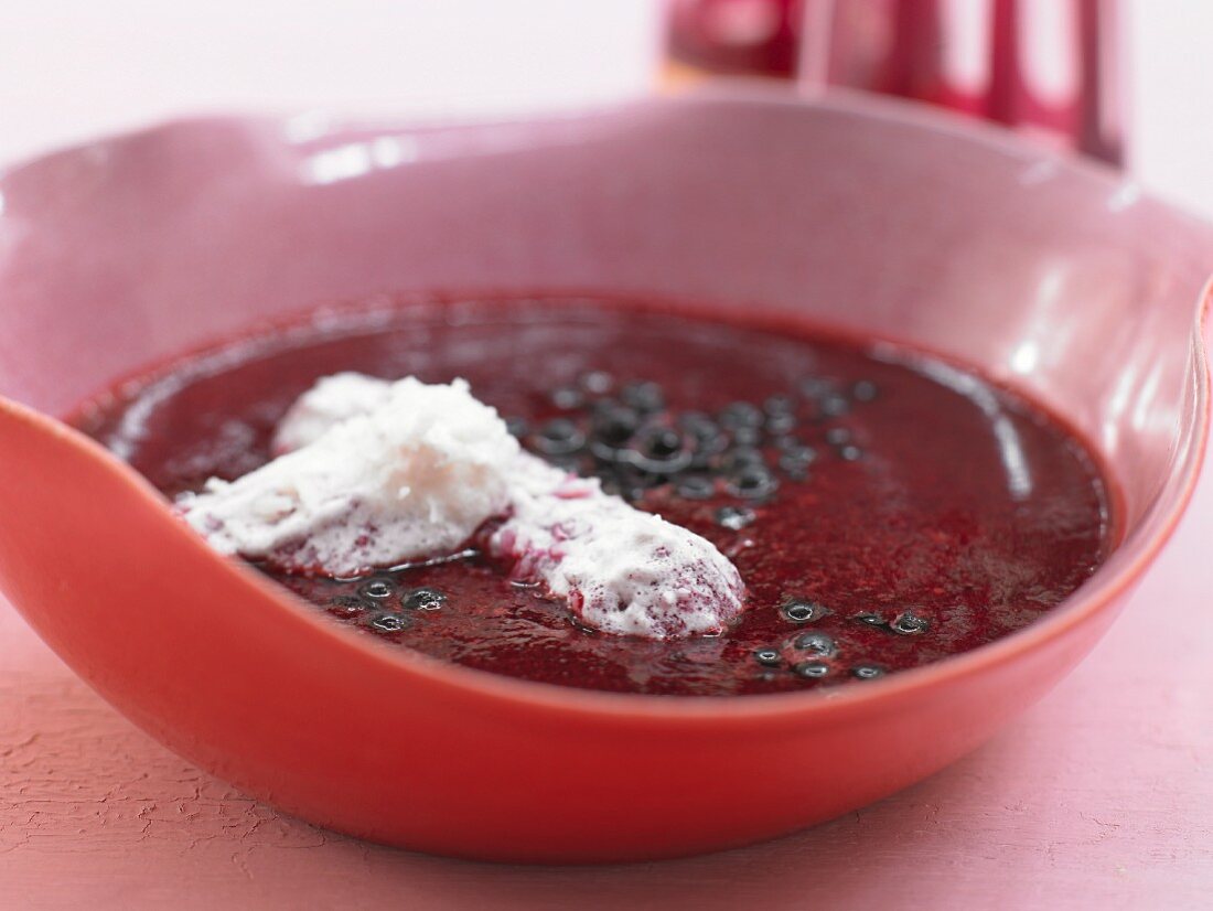 A chilled elderberry dish with coconut sauce